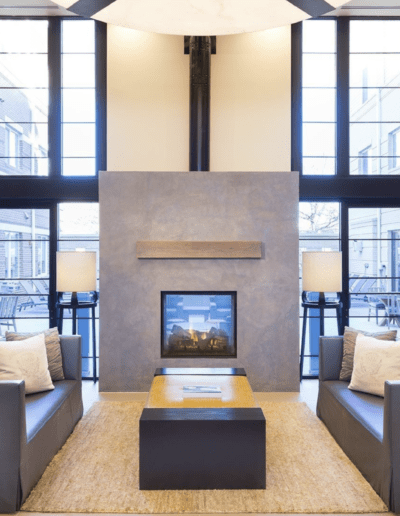 Lobby Includes Central Fireplace With Comfortable Seating Arrangements